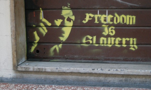 Freedom is slovery :: Murales